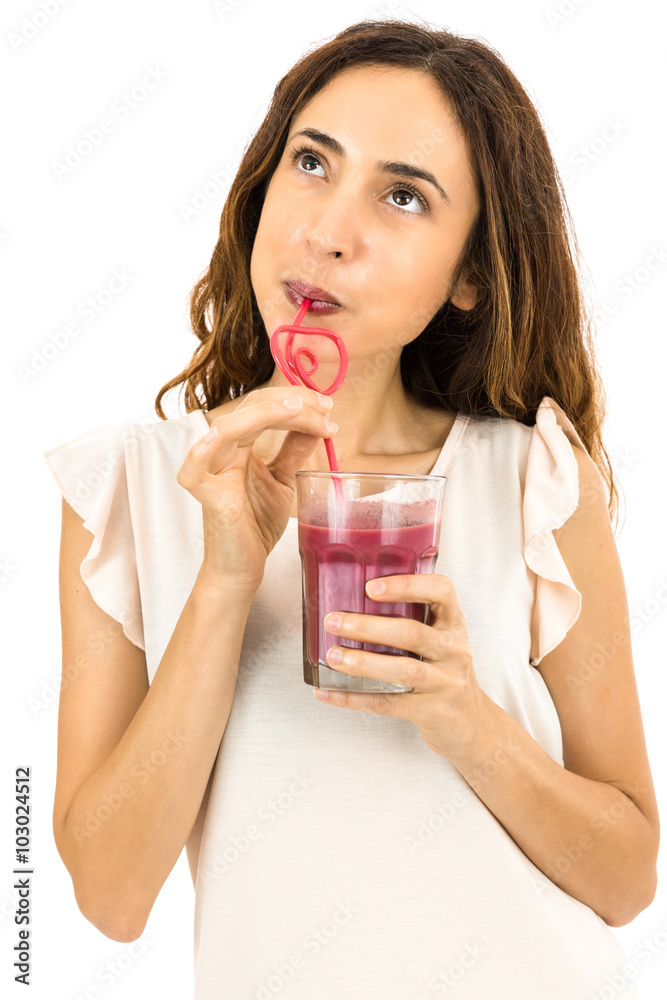 Smoothie drinking woman looking to copy space Smoothie drinking woman looking to copy space