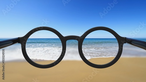 Fototapeta Naklejka Na Ścianę i Meble -  Closeup on eyeglasses with focused and blurred seascape view.