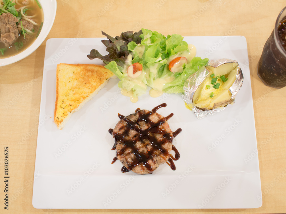 Steak, steak, pork, salad, bread and a delicious salad. Steak, steak, pork, salad, bread and a delicious salad.