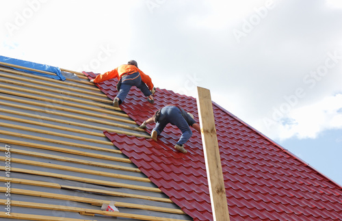 Roofers on the roof