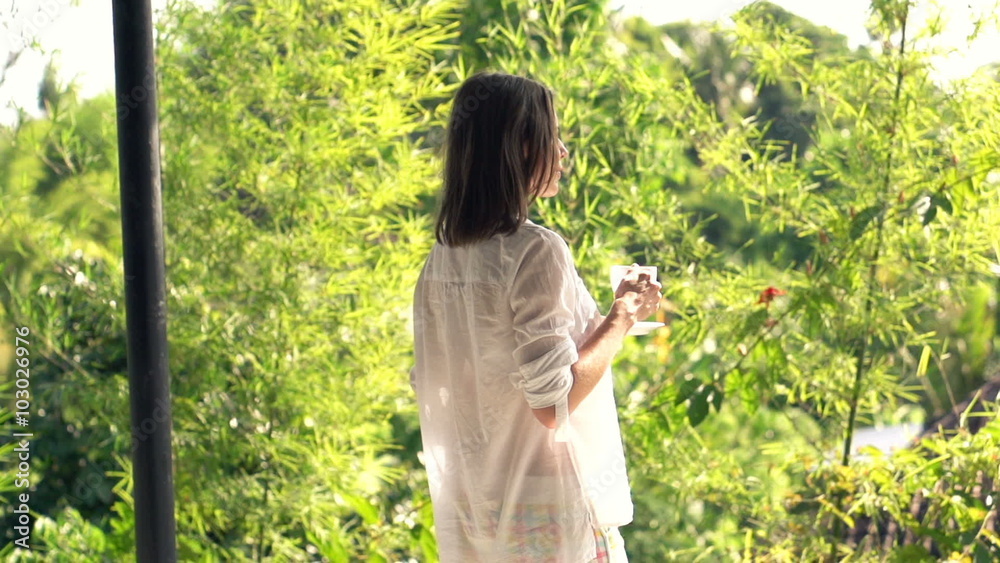 Happy woman drinking coffee on terrace, super slow motion 120fps
Happy woman drinking coffee on terrace, super slow motion 120fps