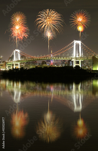Fireworks celebrating over Tokyo Rainbow Bridge at Night