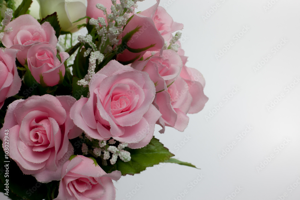 artificial pink rose on White background