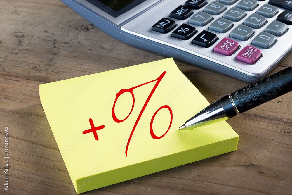 Growth Percentage Sign on yellow post it note. Calculator in the  background. Stock Photo | Adobe Stock