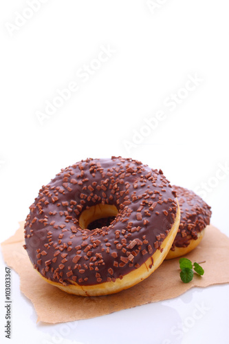 donuts with chocolate icing on a white background