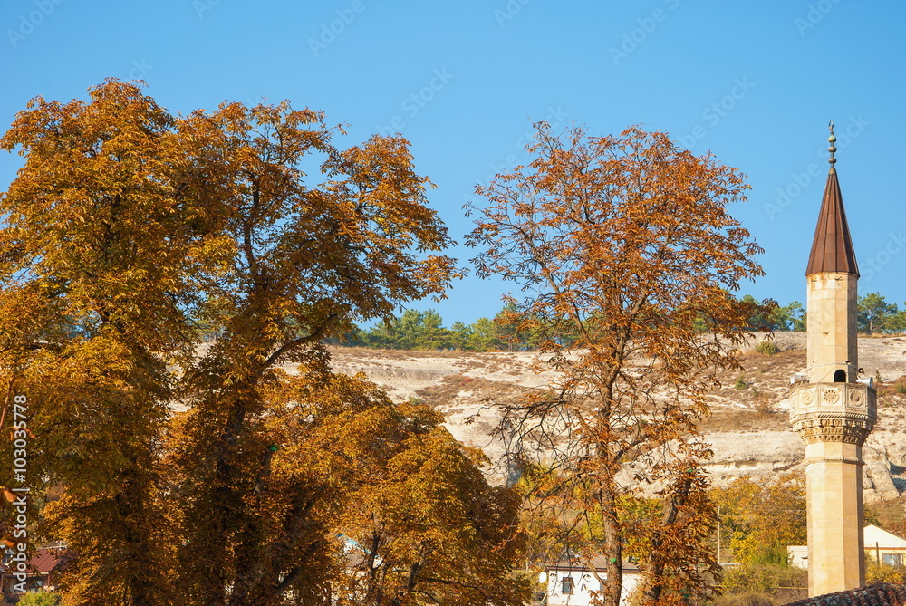 The minaret of a mosque in Bakhchisaray in the Crimea in the autumn The minaret of a mosque in Bakhchisaray in the Crimea in the autumn