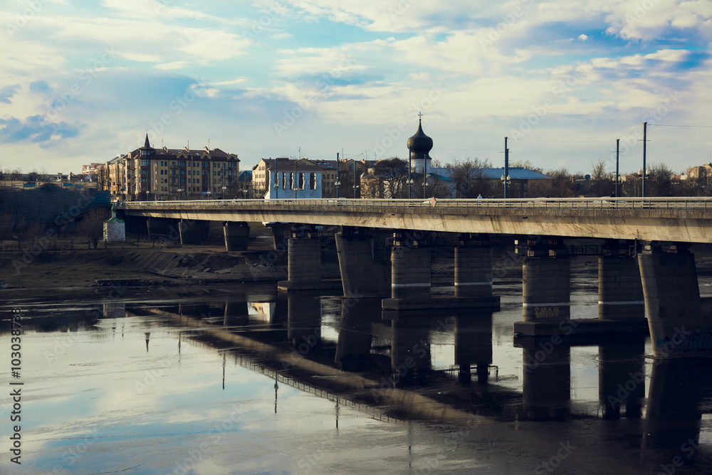 Fototapeta premium Pskov, bridge over the Velikaya river, mirroring sky