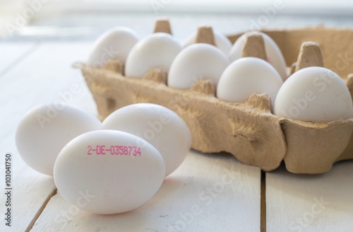 A group of fresh eggs with printed producers control serial number