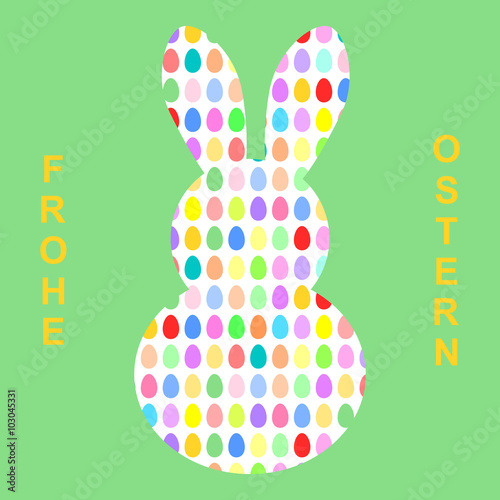Osterhase geformt aus bunten Ostereiern mit Schriftzug Frohe Ostern auf Deutsch