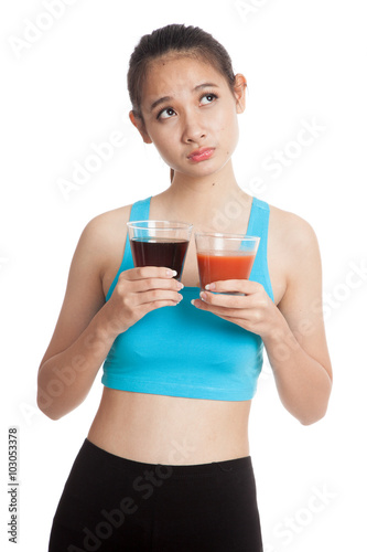 Beautiful healthy Asian girl with tomato juice and cola drinks