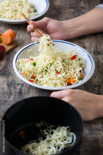 Woman Preparing Asian Noodles photo