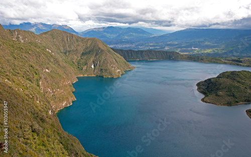 Portion of the Cuicocha lake with its surrounding crater and mountains.