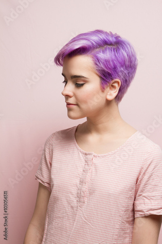 Violet-short-haired woman in pink pastel.