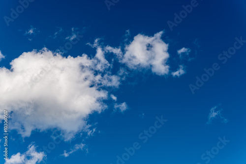 Blue sky and dramatic white clouds background on sunny day