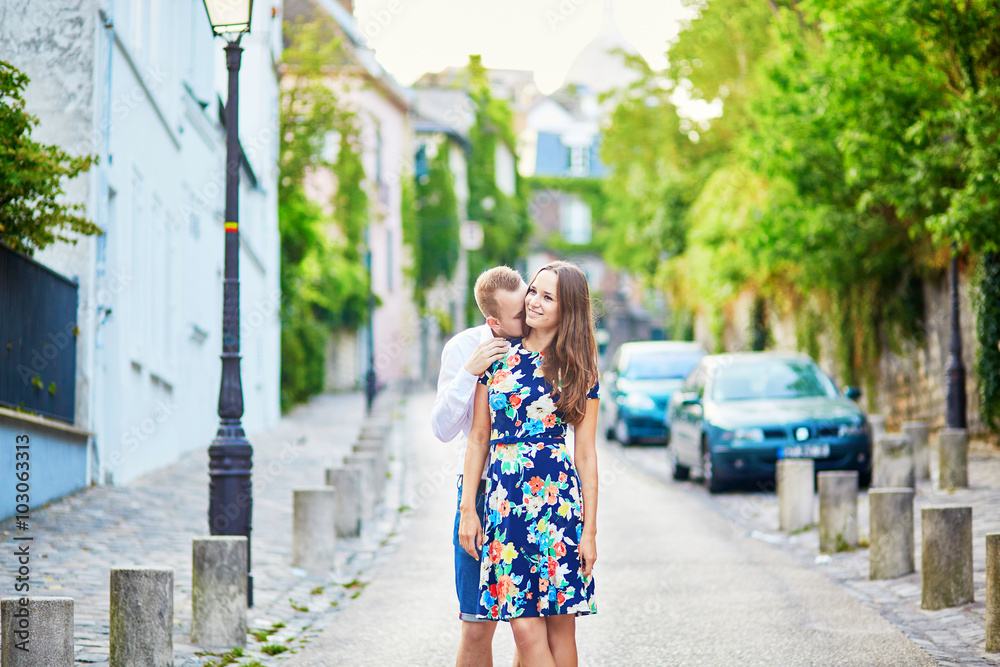 Young romantic couple hugging on Montmartre