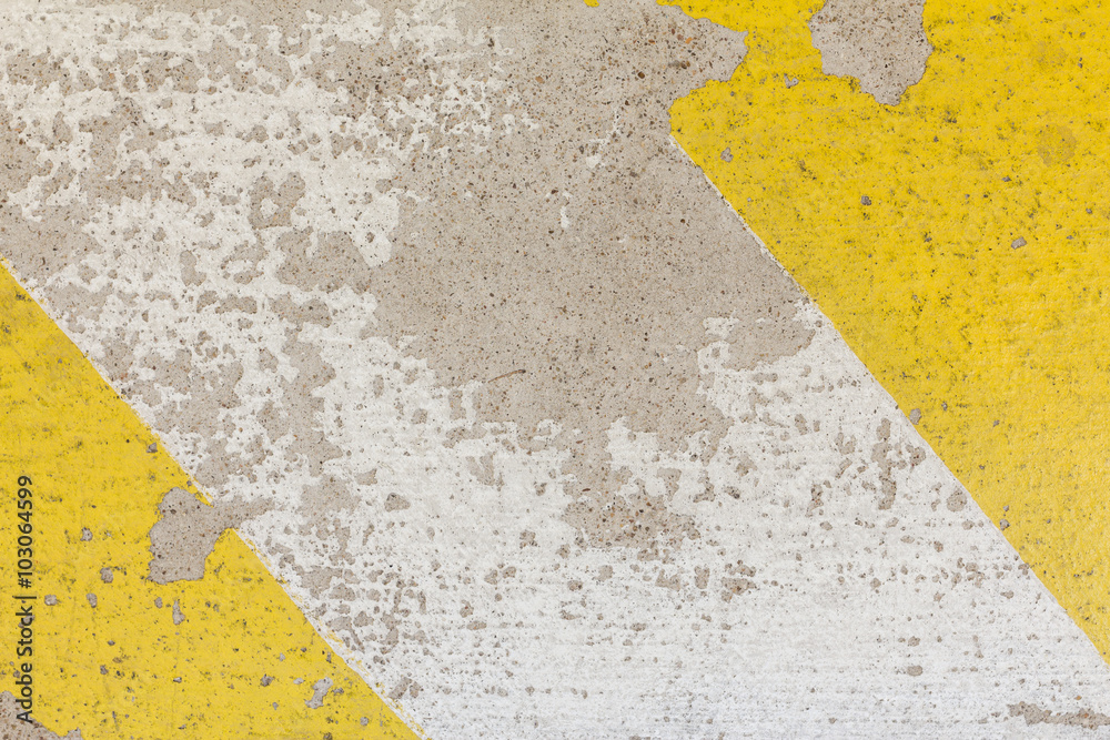 Close-up of rough speed bump in yellow and black color texture,