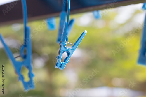 Obraz na płótnie Blue pegs of clothes hanger for underpants and socks w salonie