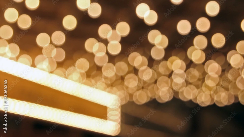 High definition movie of blinking out of focus blurred bokeh concert hall theater lights on broadway along a entertainment street 1080p
