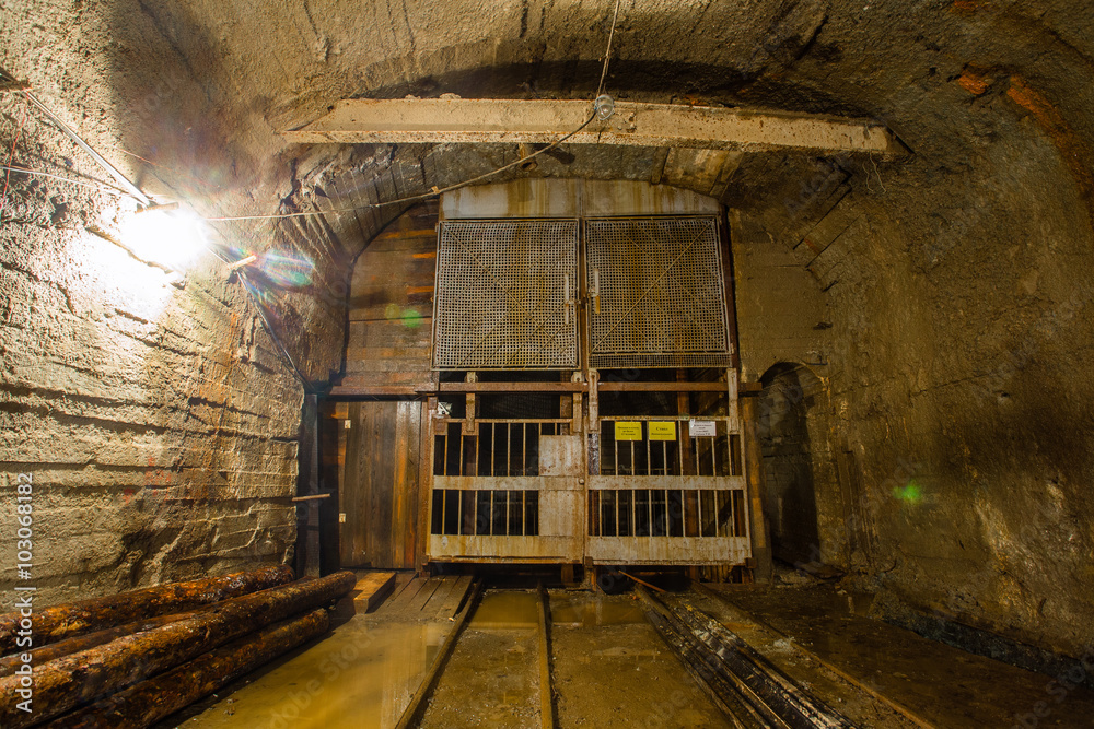 Wall murals Underground gold mine ore tuneel with rails cage Berezovsky mine  Ural - Nikkel-Art.com