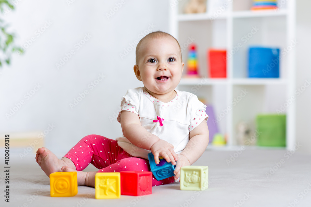 Baby girl playing cubes block toys Baby girl playing cubes block toys