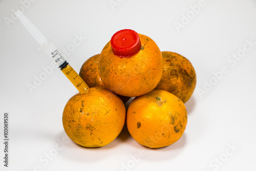 A real orange fruit was sucked with syringe