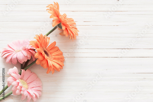 gerbera flowers on the wooden table