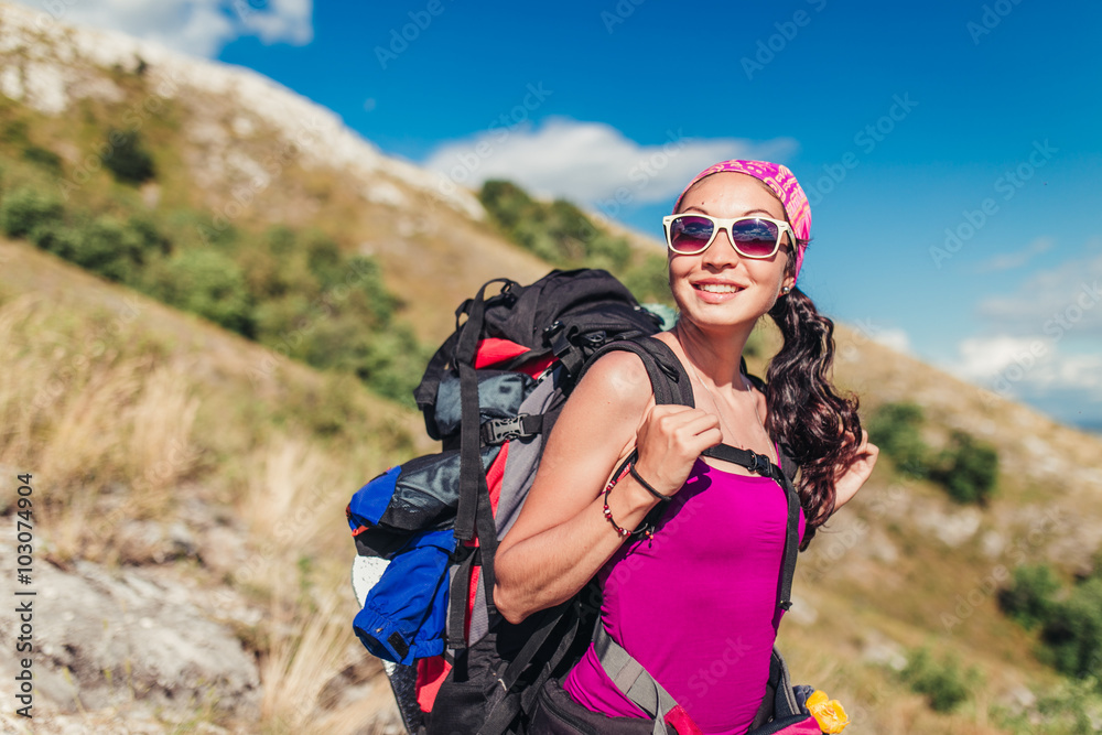 Traveler happy woman with backpack on green hill side. Traveler happy woman with backpack on green hill side.
