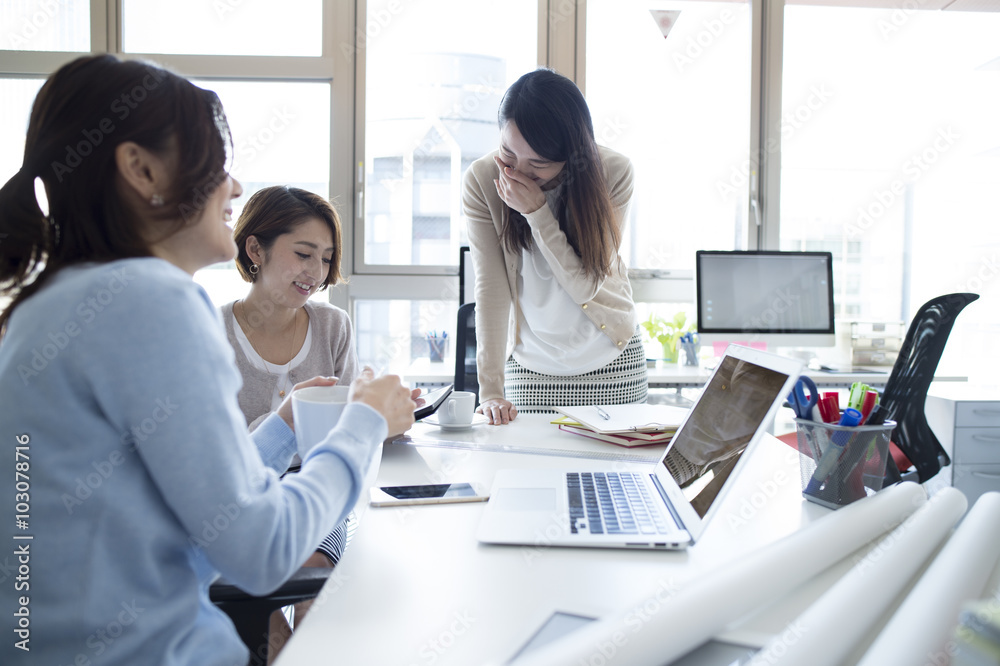 Three women have been meeting in the office Three women have been meeting in the office
