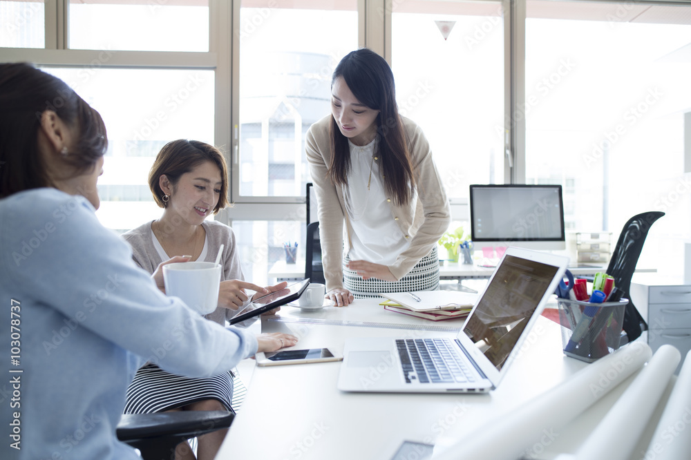 Three women have been meeting in the office Three women have been meeting in the office