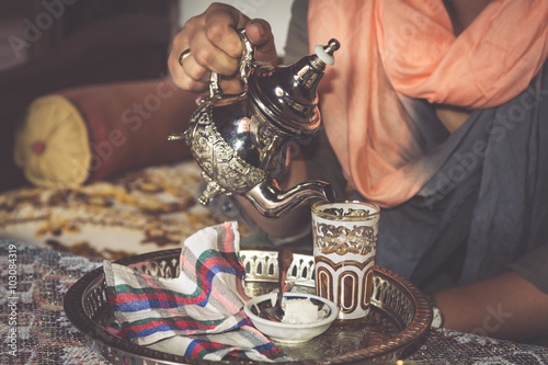 Obraz na płótnie Moroccan teapot and cup to drink the famous mint. w salonie