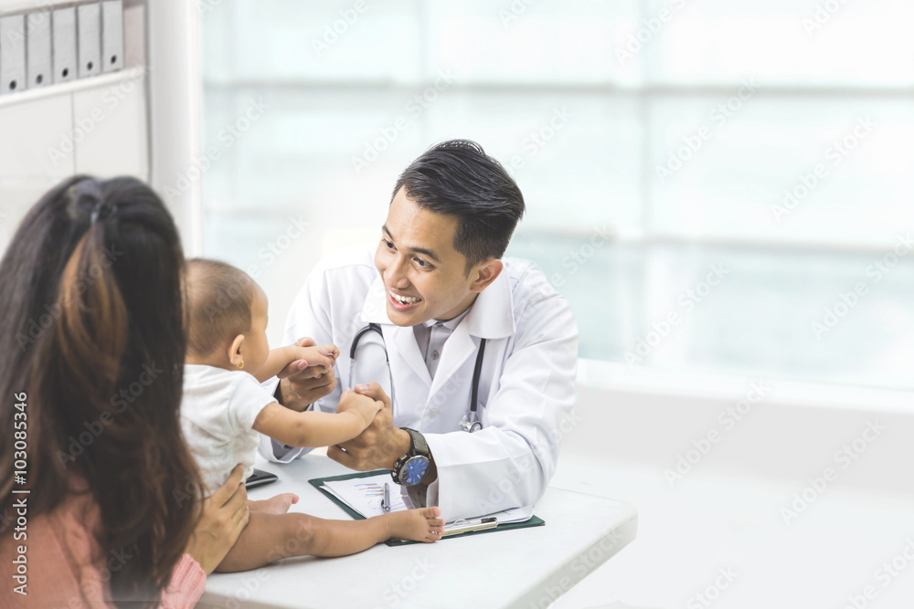 baby being checked by a doctor baby being checked by a doctor