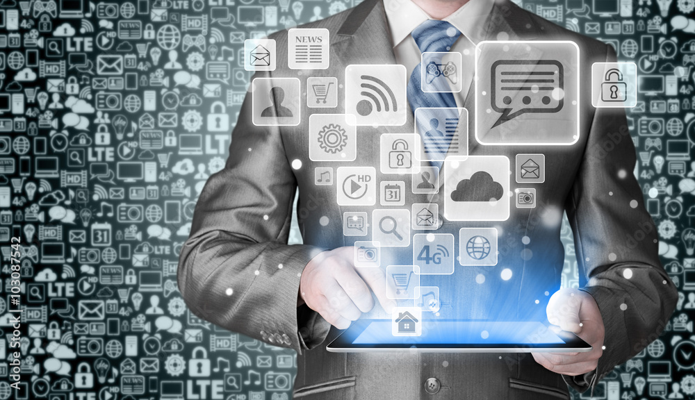 Business man using tablet PC with social media icon set Business man using tablet PC with social media icon set
