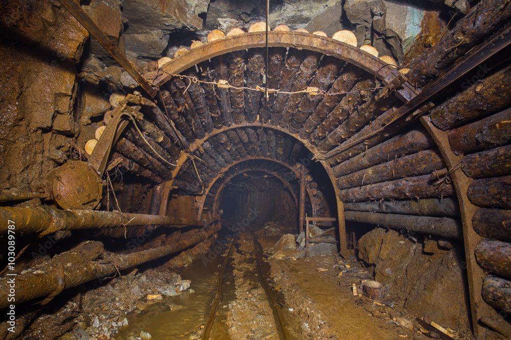underground abandoned gold mine ore tunnel with rails Berezovsky mine Ural
