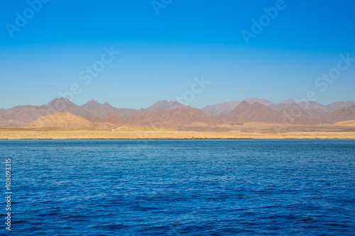 View on red mountains from the sea