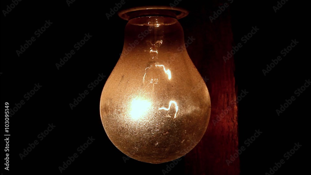turn on and off light bulb hanging on a wooden beam turn on and off light bulb hanging on a wooden beam
