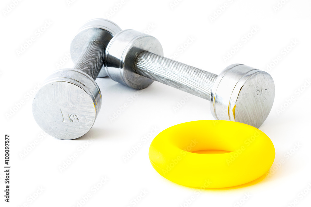Chromed 1 kg dumdbells and a rubber hand ring on white background