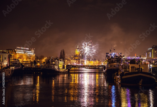 Photography AMSTERDAM, NETHERLANDS - JANUARY 1, 2016: Festive salute of fireworks on New Year's night