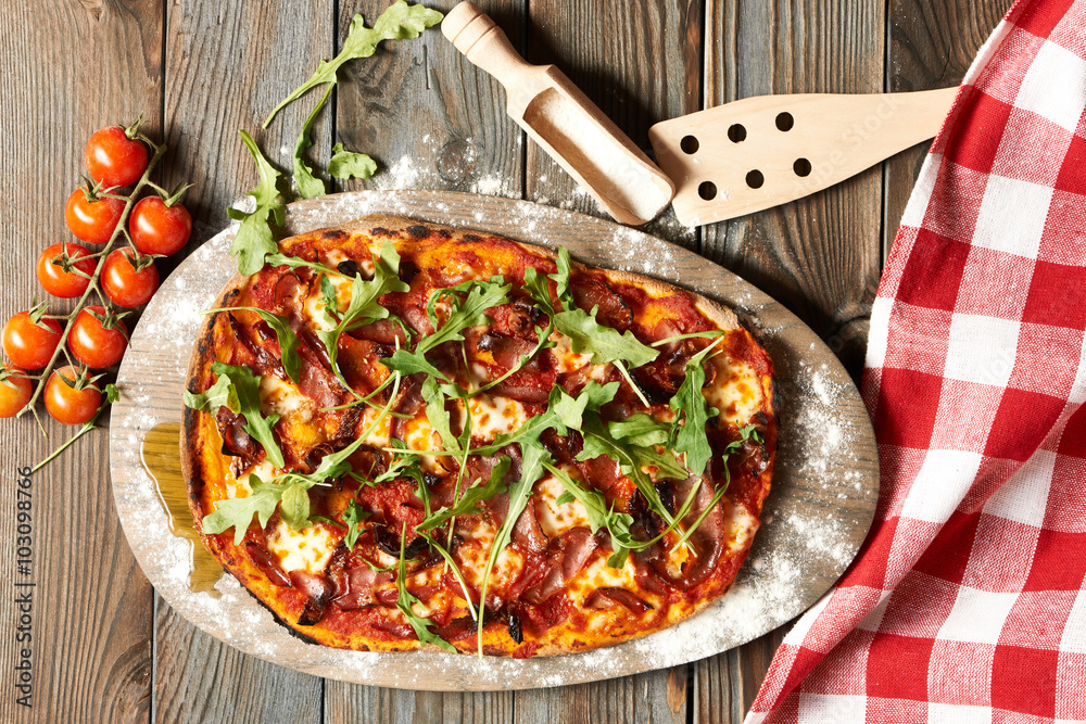 Home made pizza on wooden table Home made pizza on wooden table