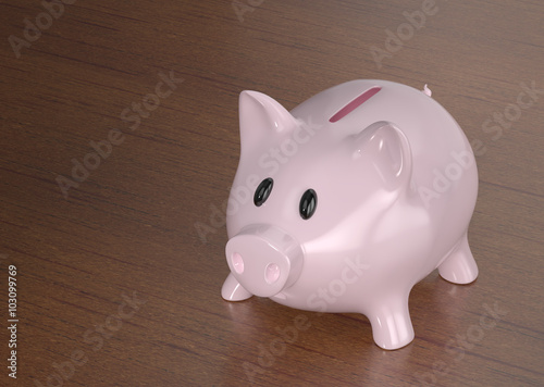 Piggy bank on a wooden background