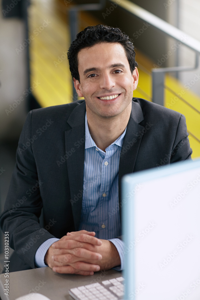 Portrait of a confident businessman at work in his glass office Portrait of a confident businessman at work in his glass office