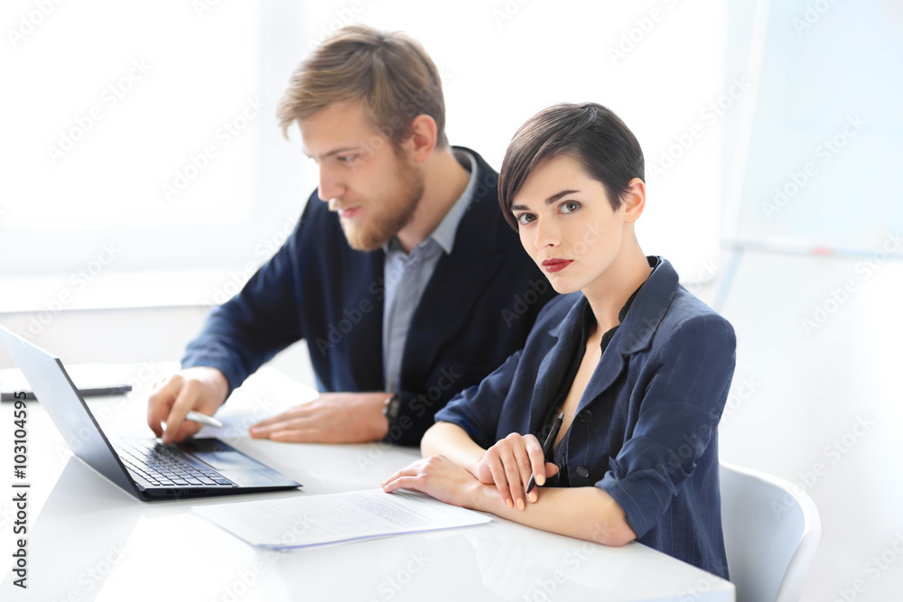 Businesswoman and businessman working in the office Businesswoman and businessman working in the office
