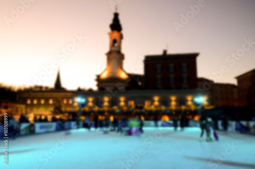Abstract blur of people skating in the park on winter skating riding