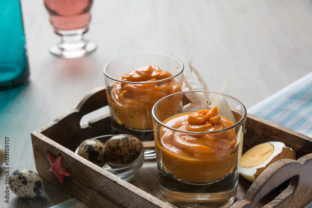 salmorejo in crystal glasses, in a wooden tray salmorejo in crystal glasses, in a wooden tray