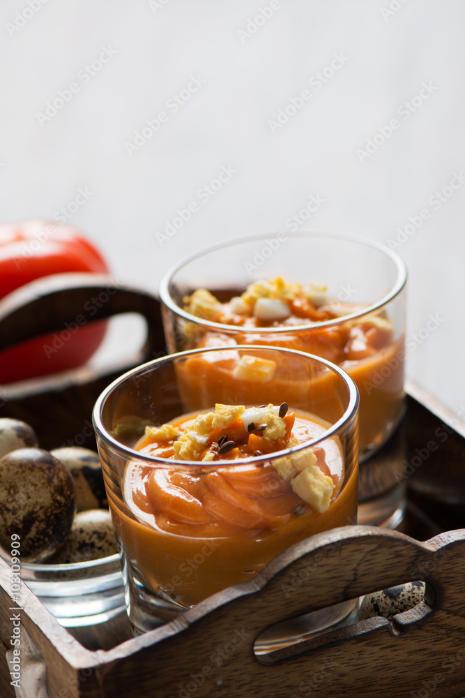 salmorejo in crystal glasses, in a wooden tray