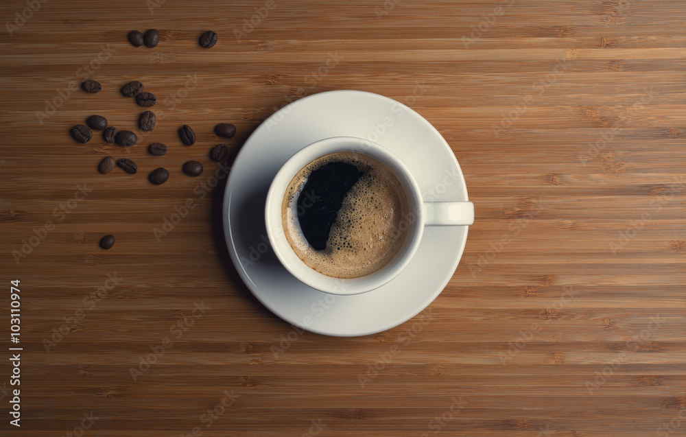 Coffee cup top view on wooden table background Coffee cup top view on wooden table background