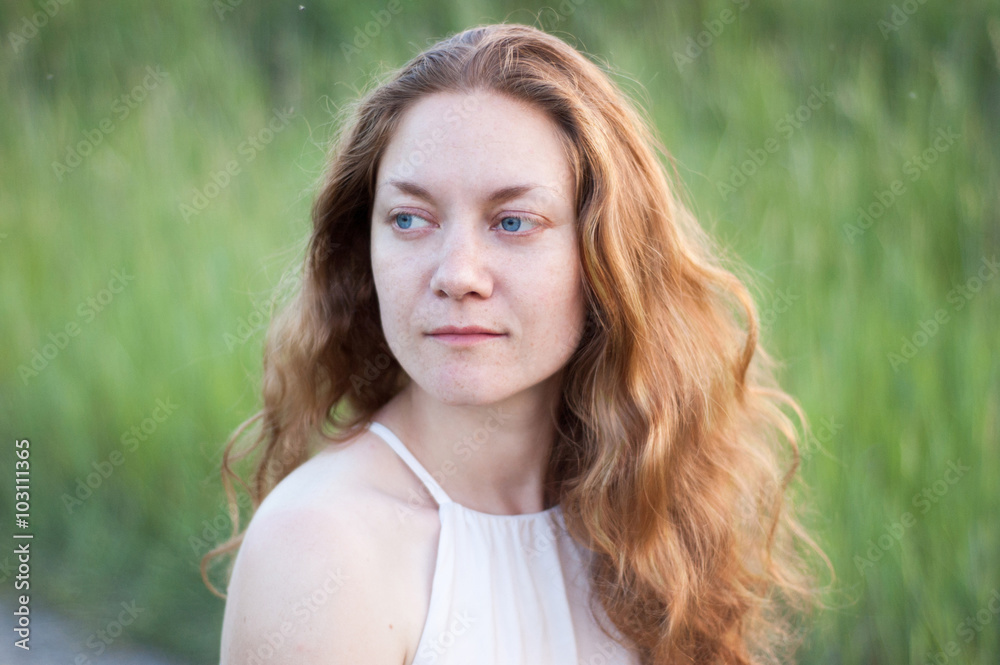 woman with long red curly hair and blue eyes woman with long red curly hair and blue eyes