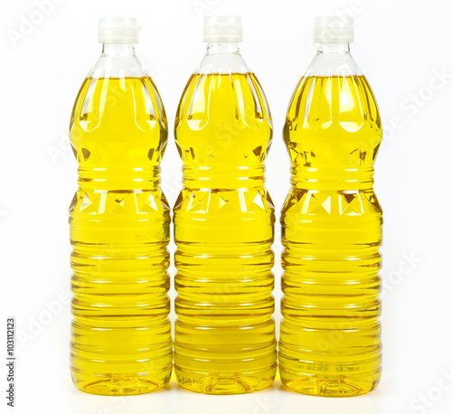 three bottles oil of refined palm olein from pericarp photo