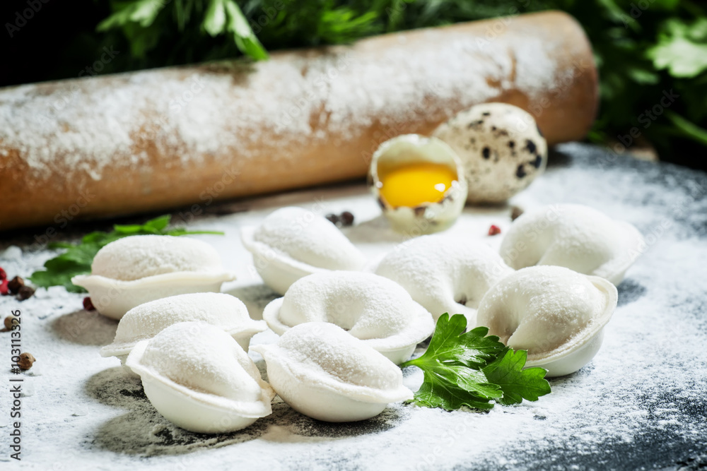 Traditional Russian dumplings with minced meat on the table with Traditional Russian dumplings with minced meat on the table with