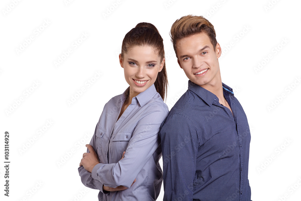 Successful business couple is standing in studio Successful business couple is standing in studio