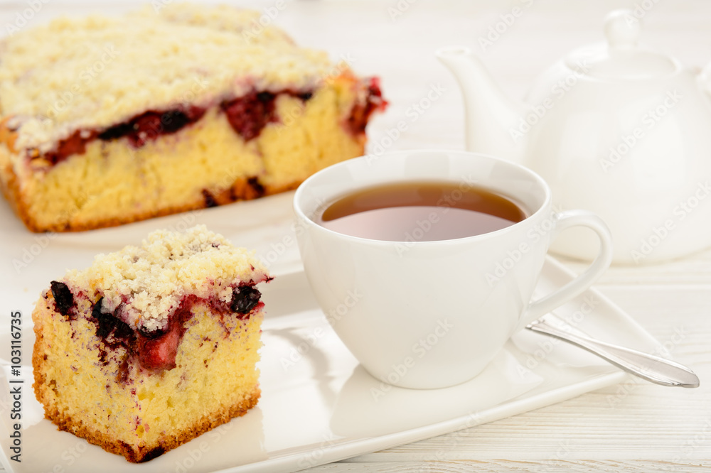 Sweet homemade cake with berries and cup of tea Sweet homemade cake with berries and cup of tea